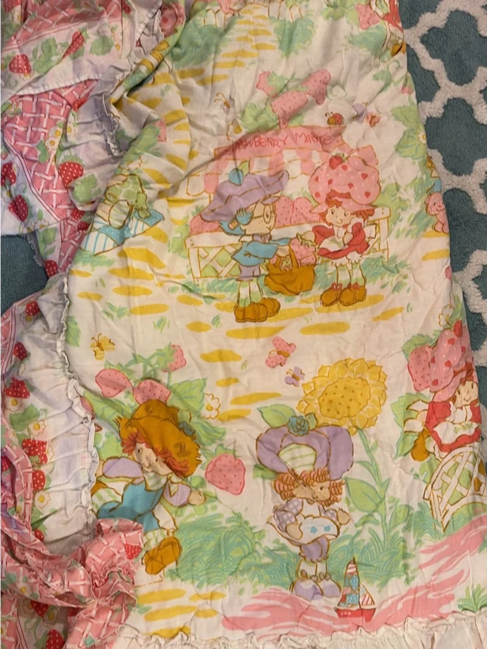 Vintage 1980 Strawberry Shortcake bedspread and pair of curtains with ties.